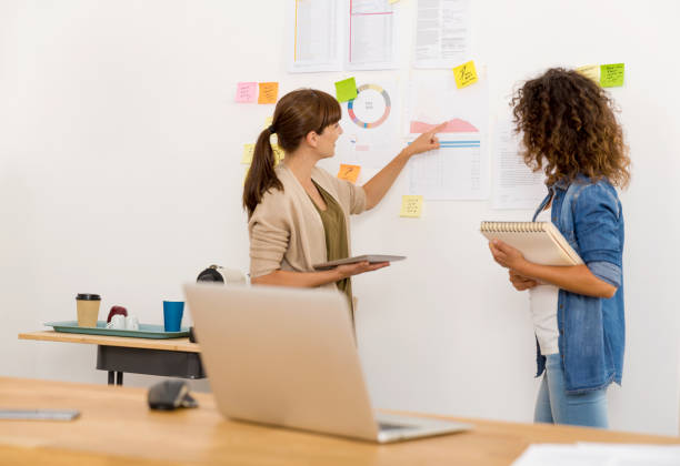 istock Two businesswoman working together 1175250656