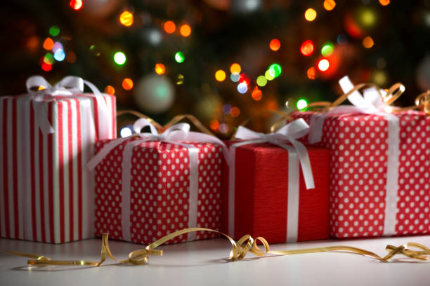 istock Christmas gifts on festive lights background 1175250767