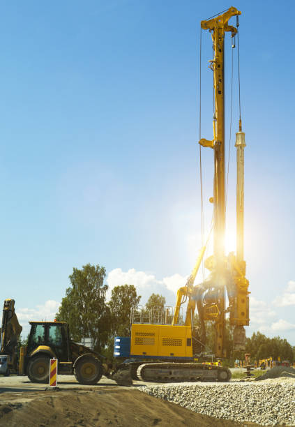 istock Hydraulic pile driver working on the road construction. 1175250943