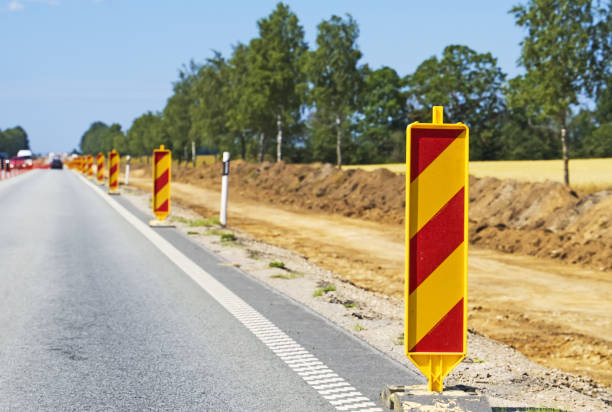 istock Warning signs along the road. Road reconstruction. 1175250955
