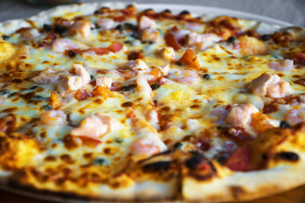 istock Pizza with seafood. Mozzarella, tuna and shrimps. 1175251038