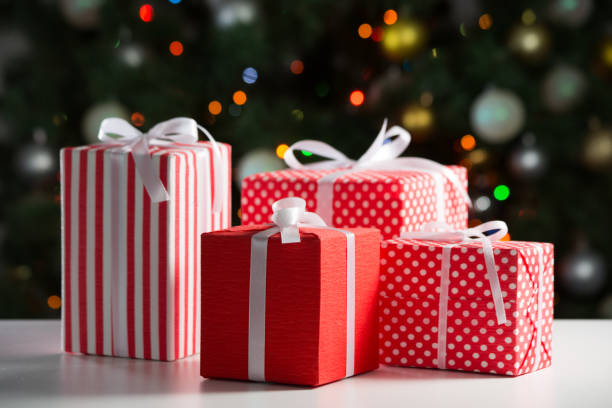 istock Christmas gifts on festive lights background 1175251123