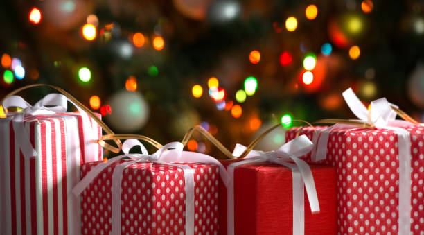 istock Christmas gifts on festive lights background 1175251167