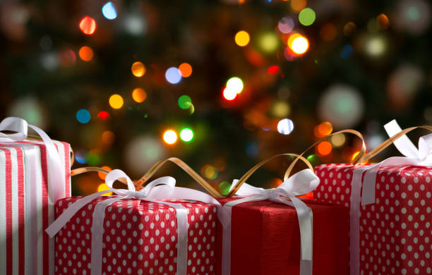 istock Christmas gifts on festive lights background 1175251886