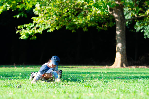 istock Father and daughter playing on the grass 1175252060