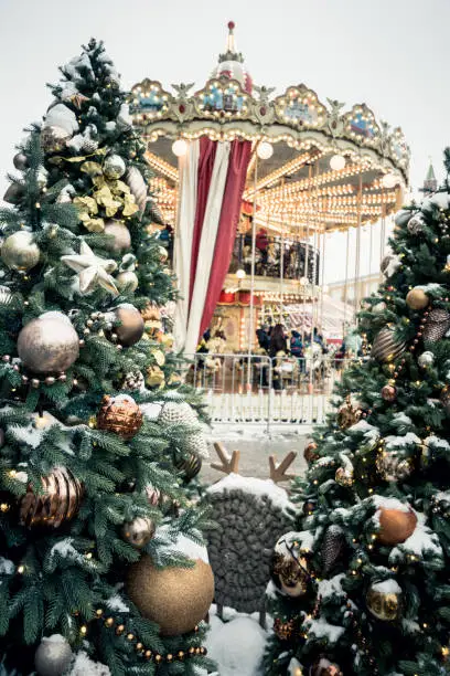 Photo of Christmas tree and carousel on Red square. Christmas celebration and fairy. New year. Decorated city.