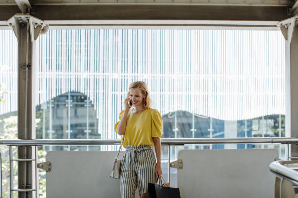 istock Elegant Woman Talking on her Cell Phone 1175252547