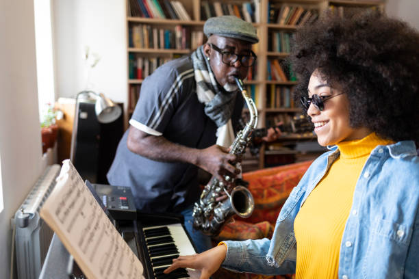 istock African ethnicity duo playing the piano at home 1175252606