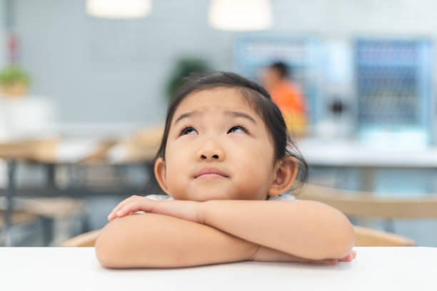 Cute little girl is thinking