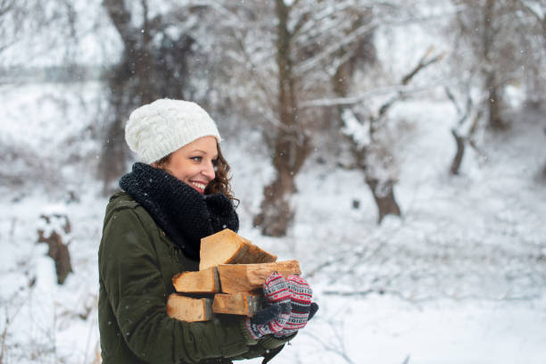 Young Smiling girl carrying firewood