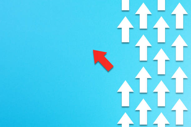 istock Red arrow coming out from the advancing white arrows, different business concept 1175254851