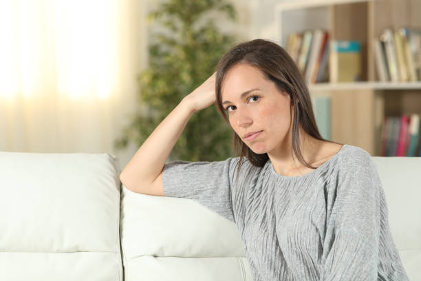 istock Serious woman at home looking at camera 1175255497