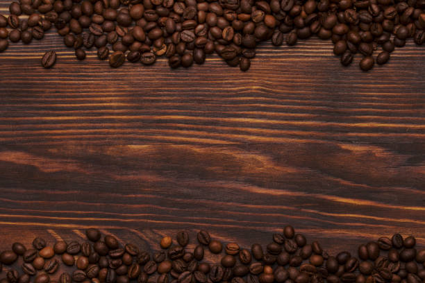 istock Coffee beans on wooden background with copyspace. 1175255721
