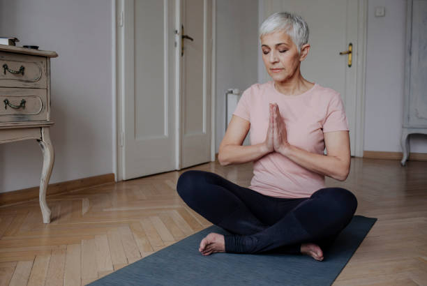 istock Senior Woman Doing Yoga 1175258493