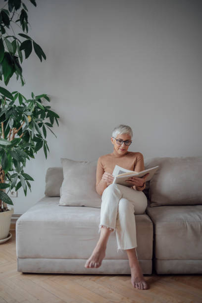 istock Senior Woman Reading at Home 1175258523