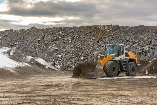 istock Machinery moving stone in a quarry 1175262631