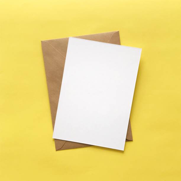 istock Flat lay of blank postcard and envelope with copy space for card mockups, invitations, backgrounds. Small yellow felt stars for crafting, DIY, design, decoration. Stationery products mock up. 1175262823
