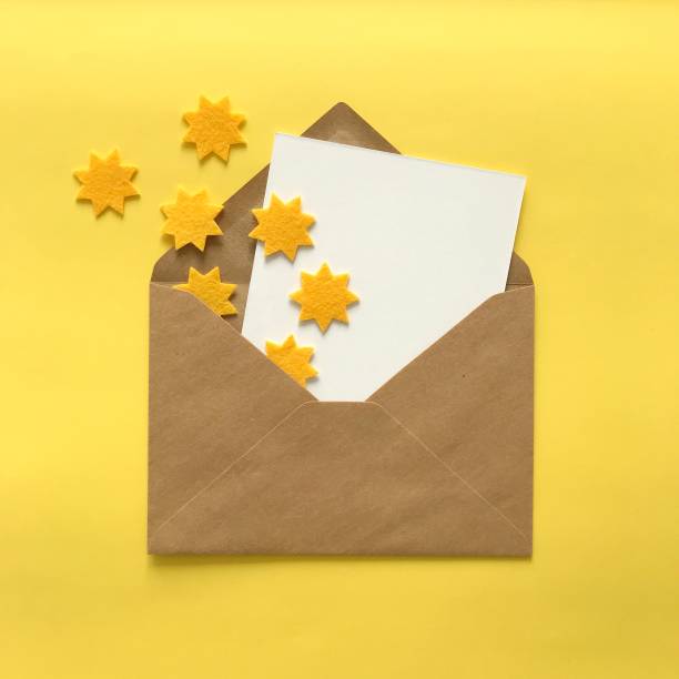istock Flat lay of blank postcard and envelope with copy space for card mockups, invitations, backgrounds. Small yellow felt stars for crafting, DIY, design, decoration. Stationery products mock up. 1175262826