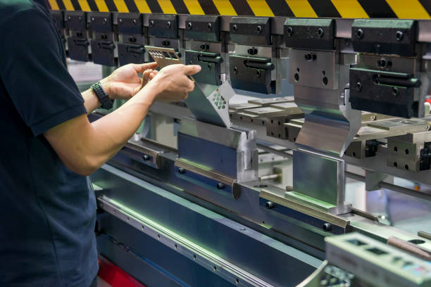 istock Operation of hydraulic bending machine with forming die by skill operator. 1175266092
