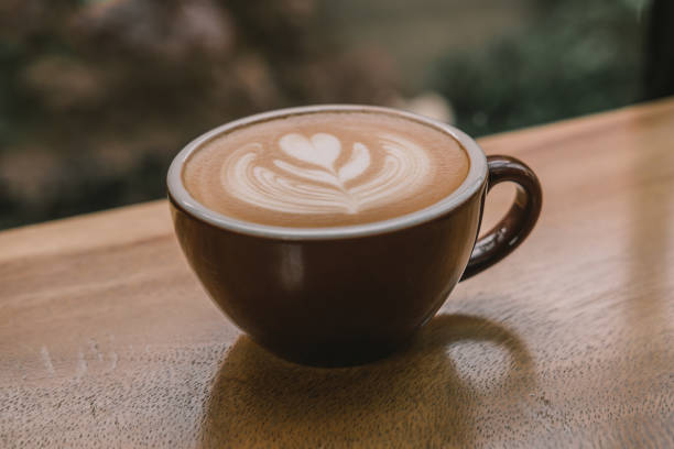 istock close-up coffee latte on the wood table. 1175266197