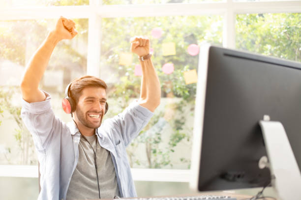 istock Happy man completed task and triumphing with raised hands and screaming. 1175266216