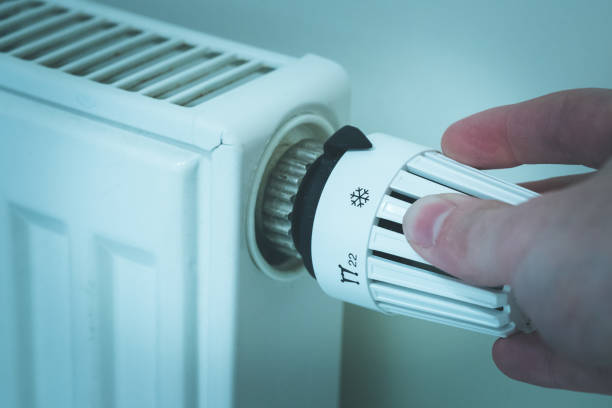 istock Heat regulator on a heater, close up picture. Heating Costs. 1175266811