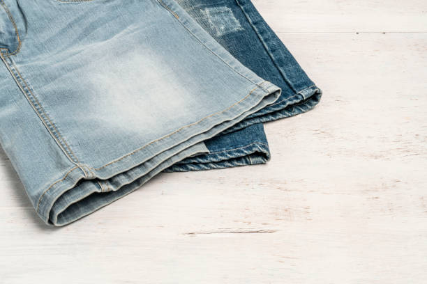 istock jean skirts on a wooden background with copy space 1175267104