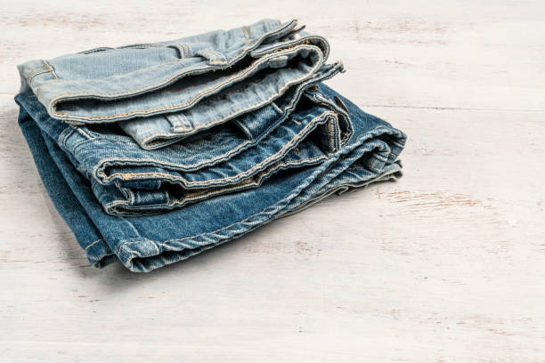 istock folded jeans on a wooden background with copy space 1175267206