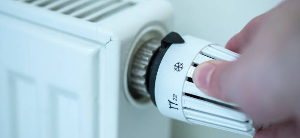 istock Heat regulator on a heater, close up picture. Heating Costs. 1175267803
