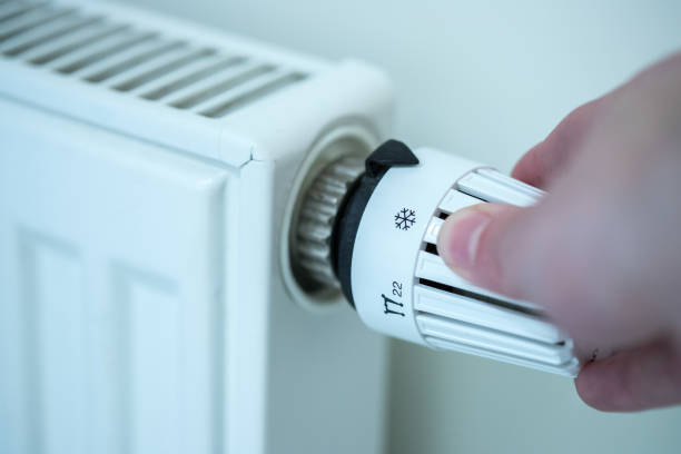 istock Heat regulator on a heater, close up picture. Heating Costs. 1175268396