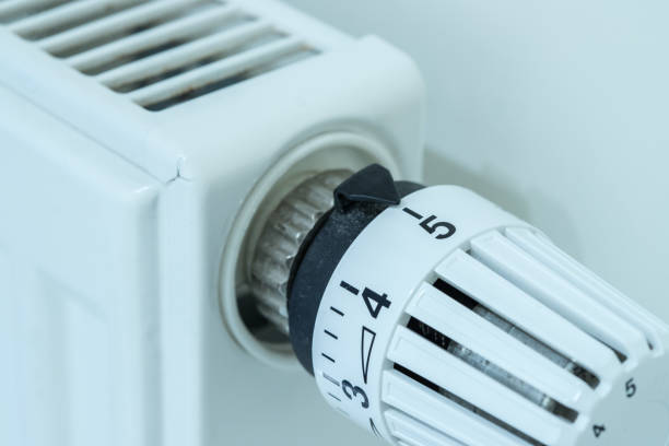 istock Heat regulator on a heater, close up picture. Heating Costs. 1175268401