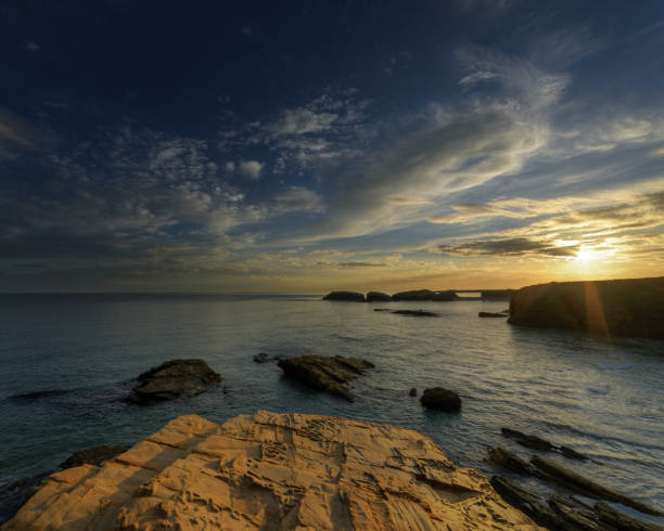 istock Evening Light Gilds the Sandstone Rock of the Coast 1175270028
