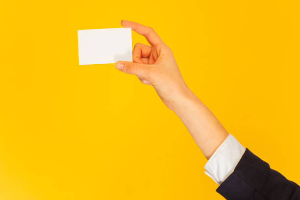 istock Woman's hand giving name card with copy space 1175270485