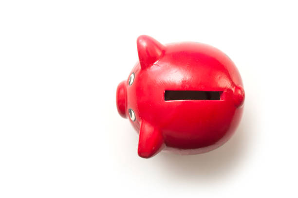 Closeup of red piggy bank on top view on white background