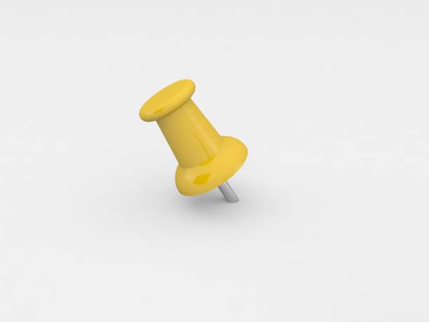 istock Yellow pushpin close up on a gray background. 1175270575