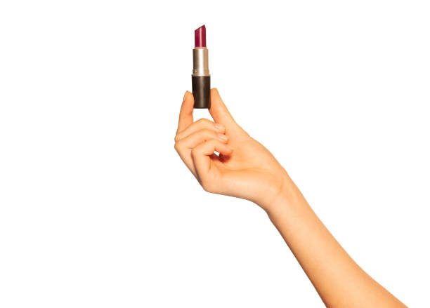 istock Female hand holding open lipstick tube on white 1175271132