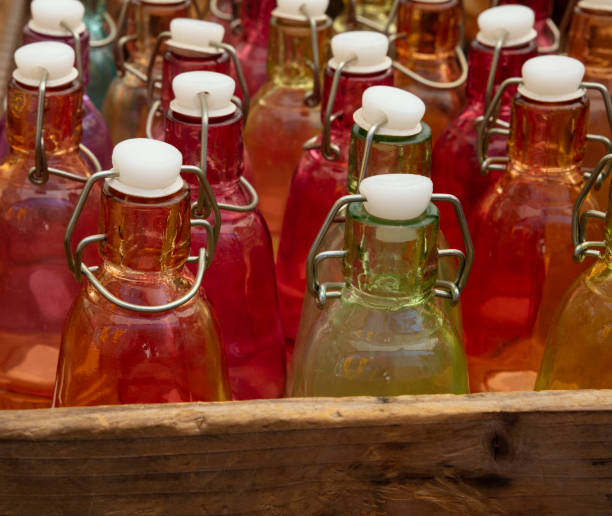 High Angle View Of Bottles On Wooden Container