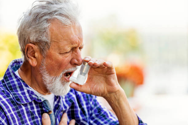 istock Senior man about to use asthma inhaler 1175281924