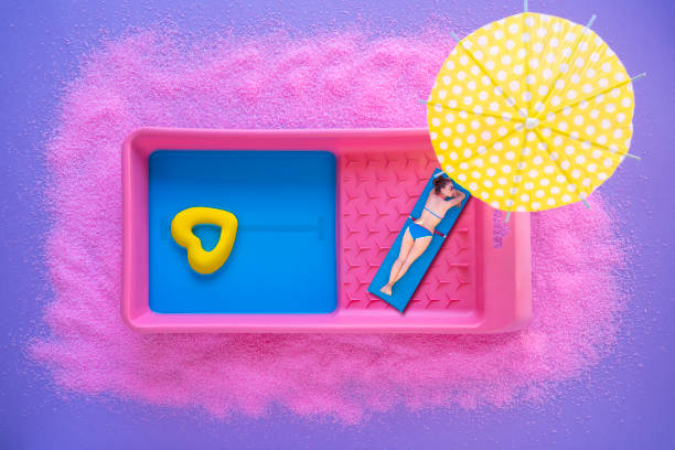 artist painter summer vacation in paint tray swimming pool concept still life