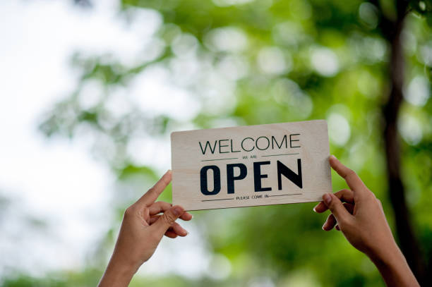 istock Hand and sign store opening 1175282288
