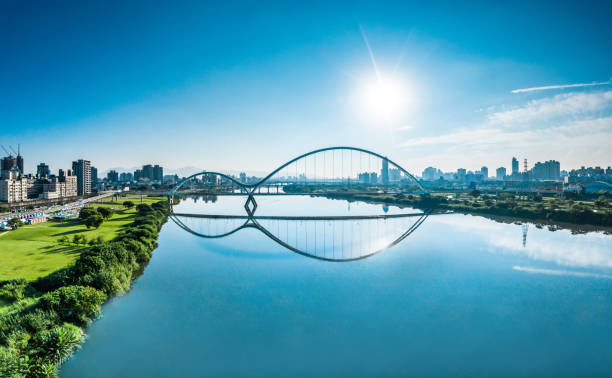 Crescent Bridge - landmark of New Taipei, Taiwan with beautiful Crescent Bridge - landmark of New Taipei, Taiwan with beautiful illumination at day, aerial photography in New Taipei, Taiwan. new taipei city stock pictures, royalty-free photos & images