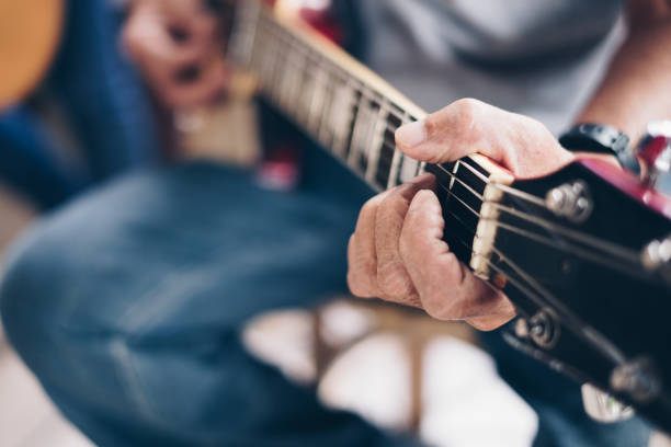 istock Man's hand the playing an electric guitar. 1175283618