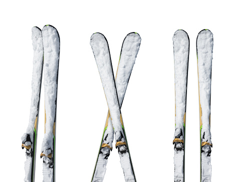 Snowcapped skis in different position isolated on white background.