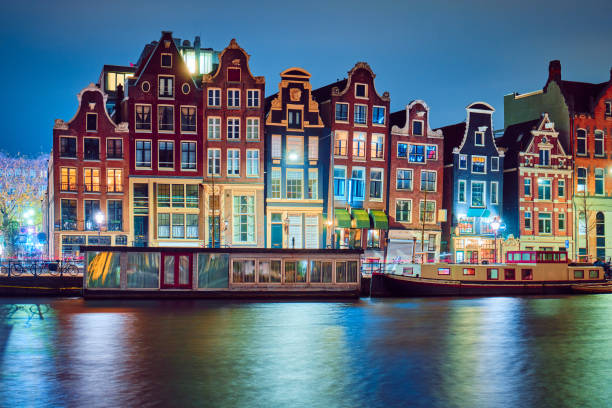 istock Traditional buildings in Amsterdam at night. 1175285951