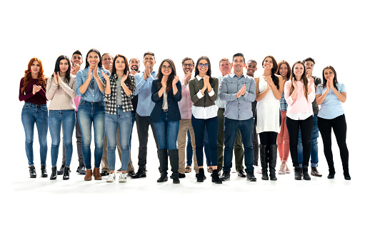 Group of happy Latin American people applauding in the studio - isolated over a white background