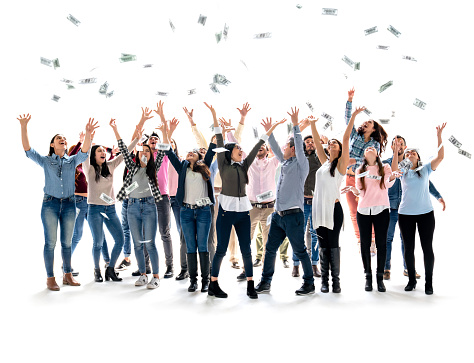 Happy group of Latin American people grabbing money in the air with arms up - isolated over a white background