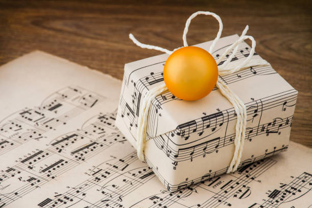 Christmas Gift With Music Notes Paper stock photo