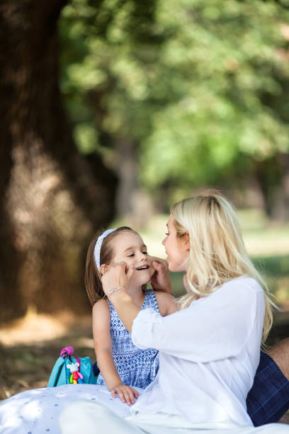 istock Single mother having fun with her daughter in nature 1175288470