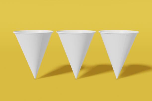 istock Set of three white paper mockup cups cone shaped on a yellow background. 3D rendering 1175289586