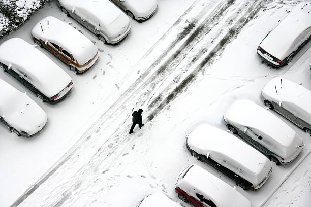 istock man walking on snow street 117529091